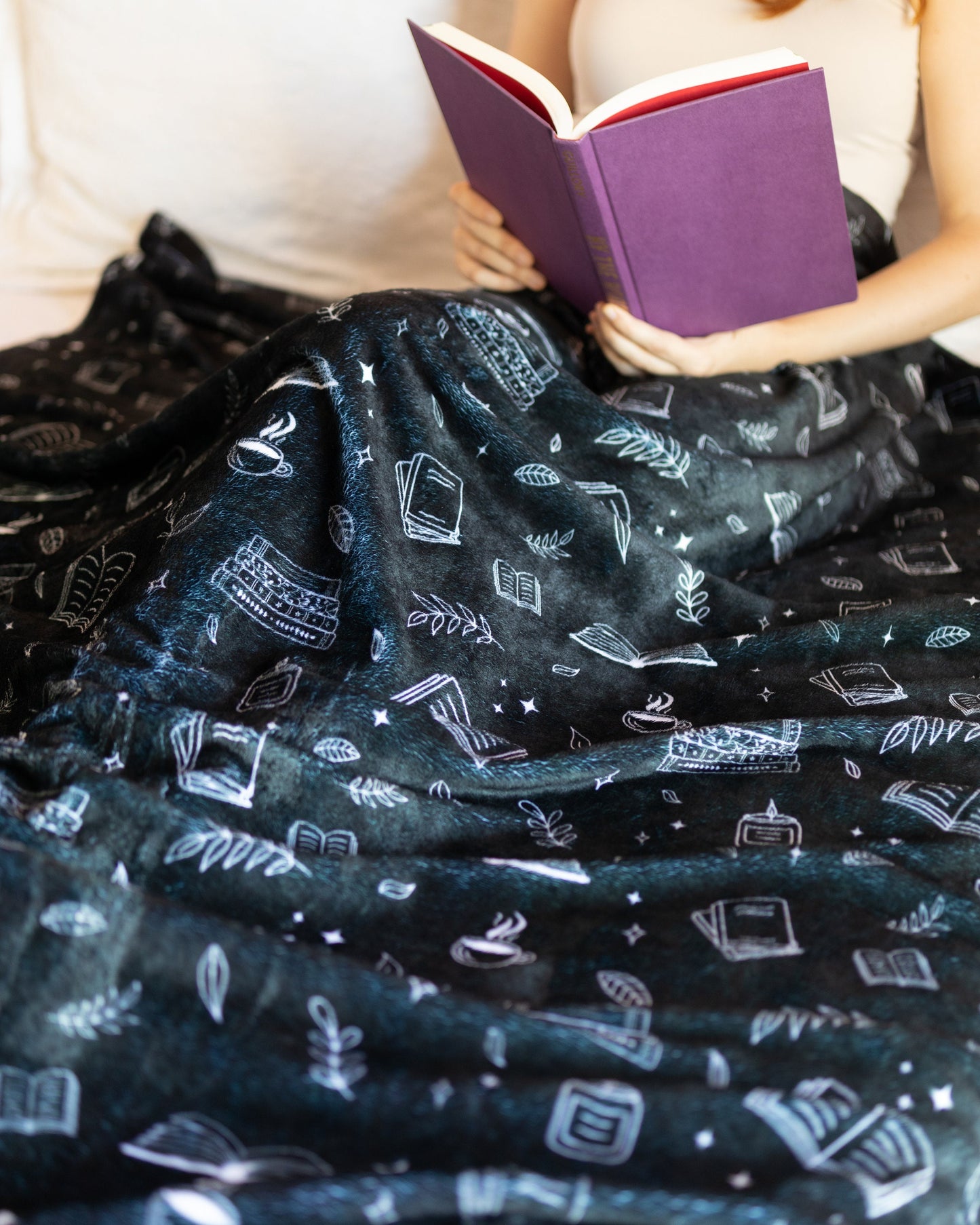 Cobertor com estampa de livro