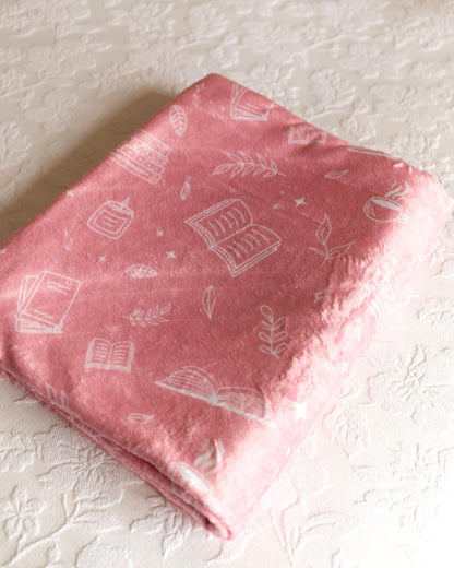 Pink Throw Blanket with Bookish Pattern